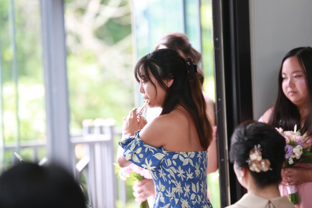 Monica in a floral dress with flowers in her hair